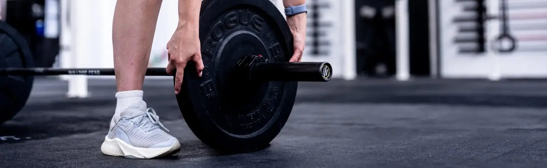 Woman setting up weight